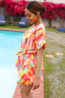 Eyes On You Coral Geo Abstract Surplice Woven Romper
